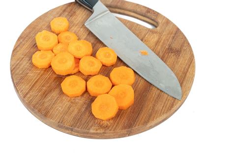 chopped pickles    wooden board  knife creative commons