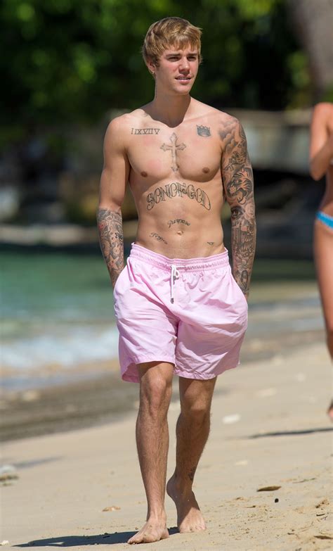 Justin Bieber Looks Buff While Taking a Shirtless Beachside Stroll in