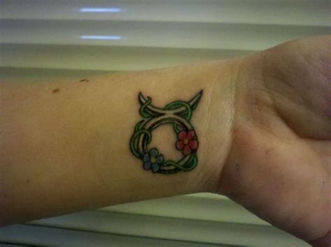 Taurus Sign Tattoo with Vine and Flowers