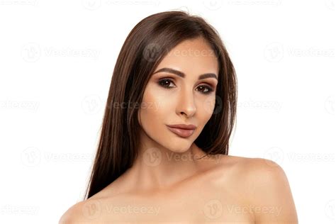Close up portrait of a brunette nude model girl with professional