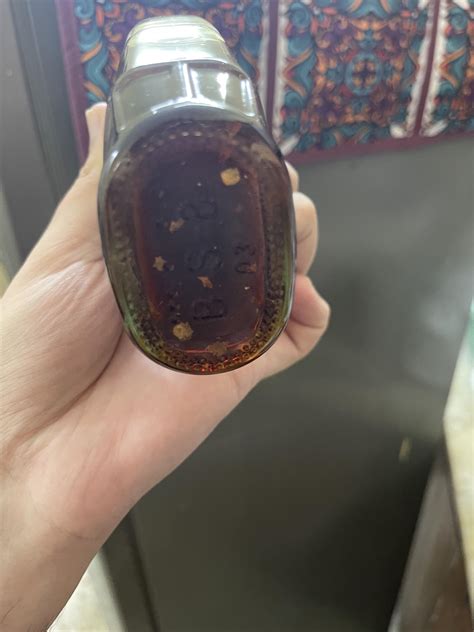 Is this mold? It's on the bottom an unopened bottle and the label says