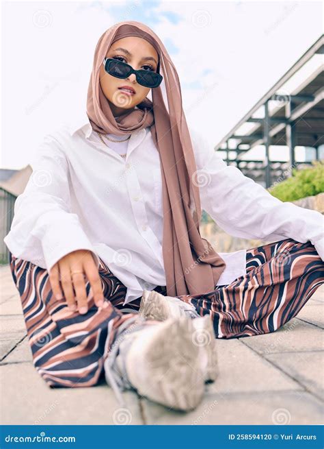 Beautiful Young Arab Woman Posing Outdoors in a Headscarf. Attractive