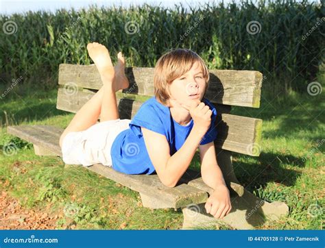 Little Kid - Boy On A Bench Stock Photo - Image: 44705128