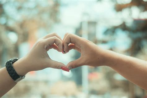 Close-up of Couple Showing Heart with Hands · Free Stock Photo