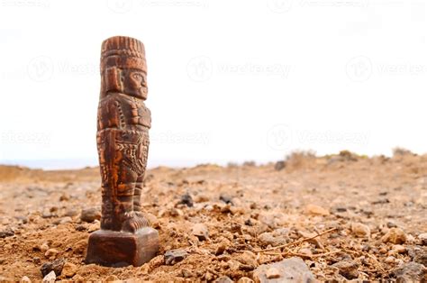 A miniature wooden statue 22136375 Stock Photo at Vecteezy