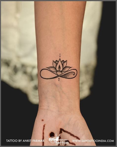 Minimal Lotus with Infinity | Cool wrist tattoos, Small hand tattoos ...