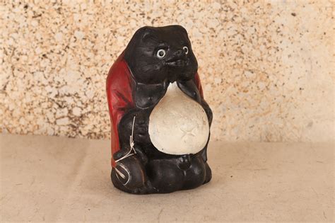 antique japanese tanuki statue symbol  luck prosperity