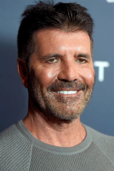 Is Simon Cowell's Approach To Fatherhood Revolutionary? Experts Weigh In. Image 13