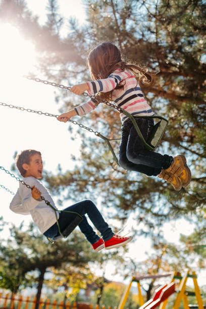 happy friends swinging   swing stock  pictures