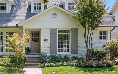 Grey wood shutters on a white brick home exterior. | Brick exterior ...