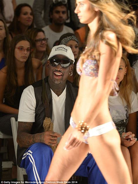 Retired NBA star Dennis Rodman leers at bikini models as he swills beer