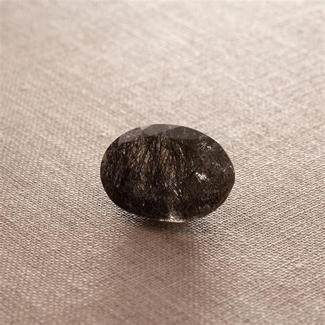 black rutile faceted gemstone
