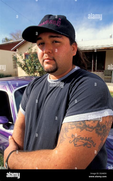 Portrait Of Mexican American Man, With Tatoo On His Arm Stock Photo - Alamy