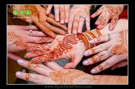 The Bride and her bridesmaids show their unique henna before a ...