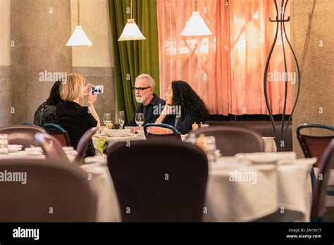 Friends in restaurant Stock Photo - Alamy