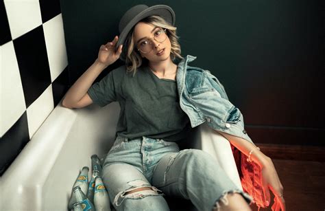 Woman Sitting in a Bathtub Fully Clothed · Free Stock Photo