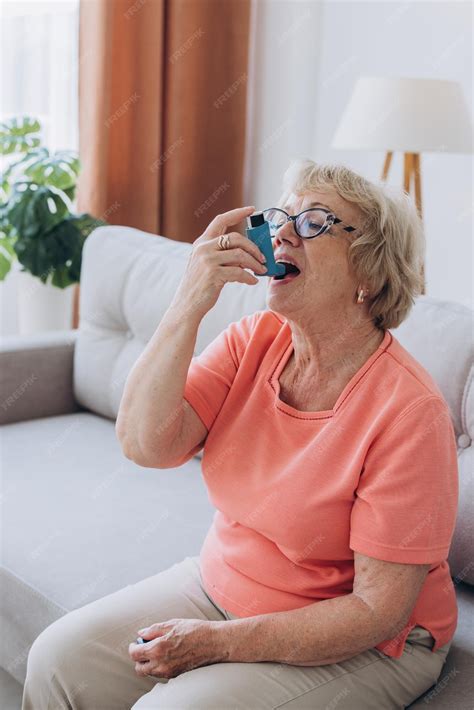 Premium Photo | Asthma oxygen and senior woman with a pump for breath