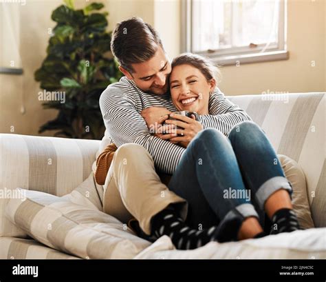 couple cuddling  couch