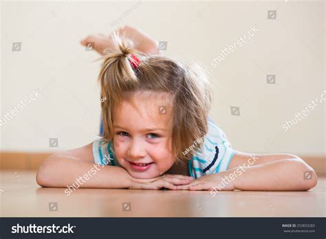female child laying floor stock photo  shutterstock