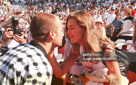 US tennis player Andre Agassi gets a kiss from his girlfriend US ...