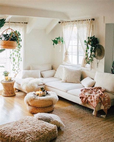 cream colored living room  brown rattan rug plants cream couch