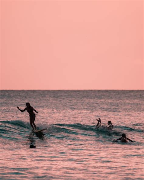 2 Person Surfing on Sea · Free Stock Photo