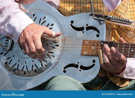 Street musician playing a dobro guitar