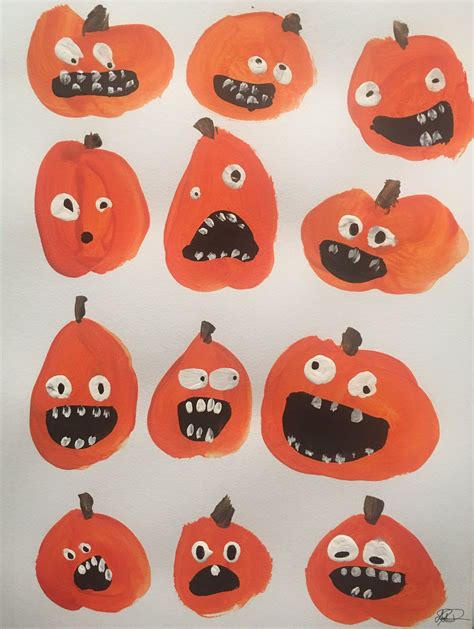 Row of Pumpkins with Faces for Halloween Decorations