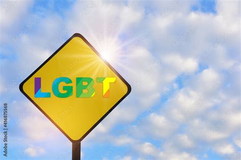 lgbt word  yellow sign  beautiful blue sky  fluffy cloud