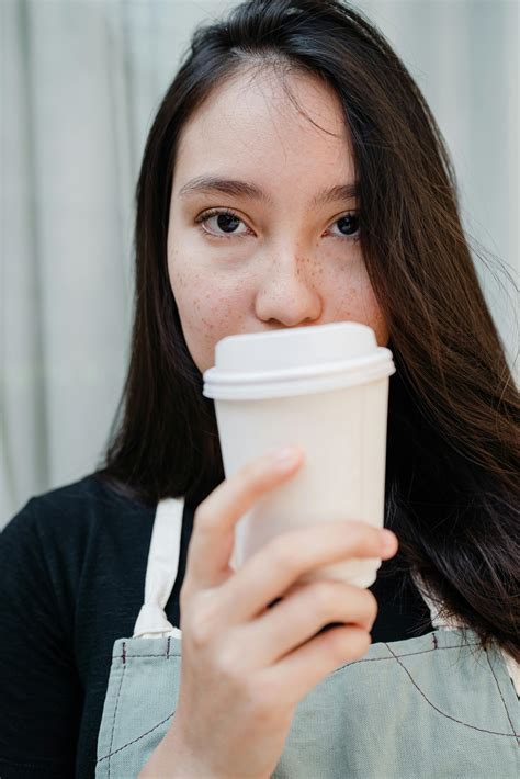 woman sipping  cup  stock photo