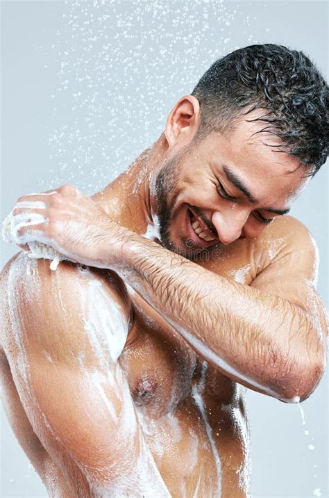 young naked man  shower stock   royalty