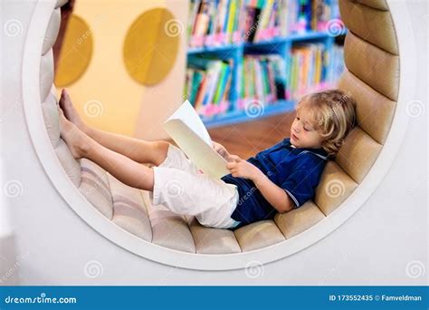 Child in School Library. Kids Reading Books Stock Image - Image of education, homework: 173552435