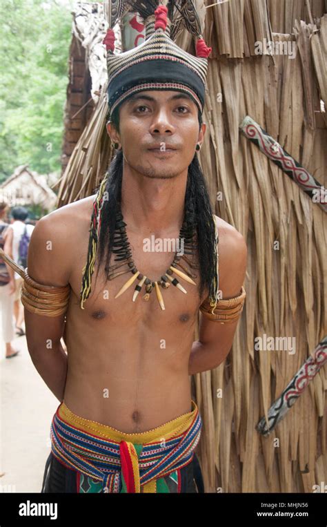 young tribesman greets visitors   murut longhouse   mari mari