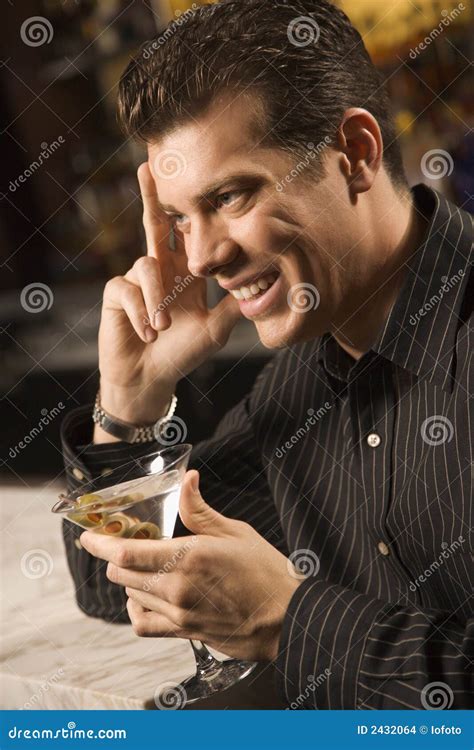 man drinking martini stock photo image  clothing leaning