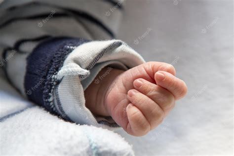 Premium Photo | Hand of newborn