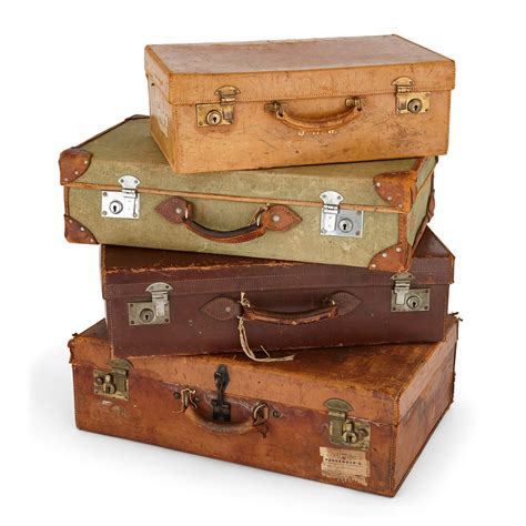 Collection of antique luggage, a set of four English travel cases ...