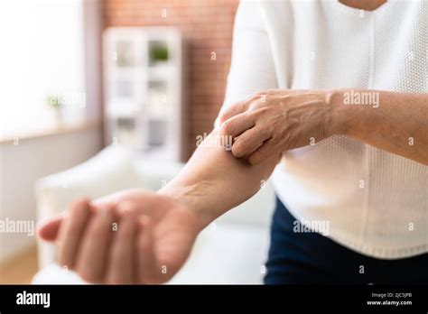 woman scratching itching body skin  allergy stock photo alamy