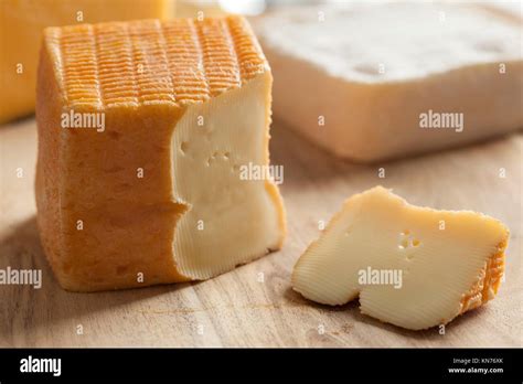 Piece of Belgian Limburger cheese on a cheese board Stock Photo - Alamy