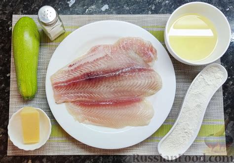 Рецепт: Рыба, запечённая с сыром и кабачковой "чешуёй" на RussianFood.com