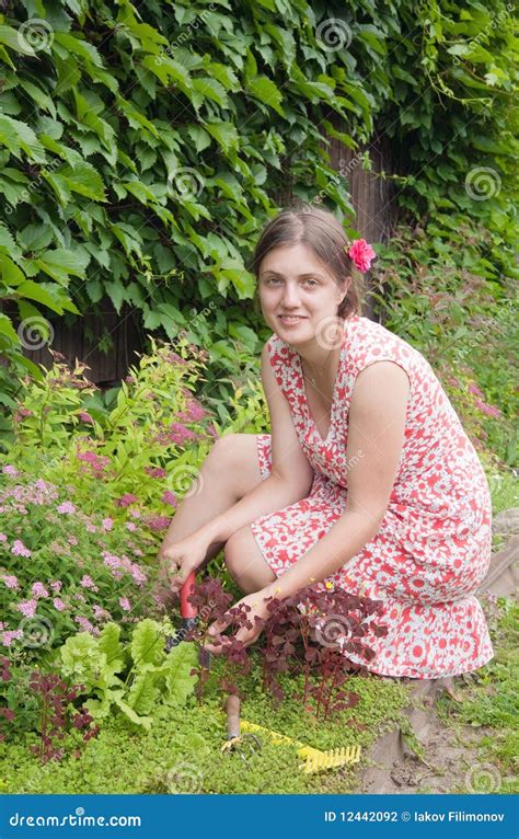 Beautiful Young Woman in the Yard Gardening Stock Photo - Image of ...