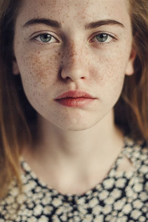 "Face Of A Beautiful Girl With Freckles Close-up" by Stocksy