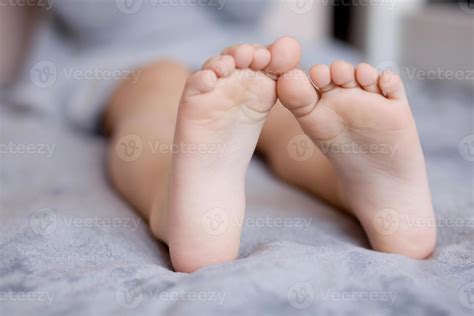 Children's feet touch each other close-up, Children's toes, heel feet
