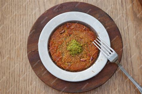 Premium Photo | Turkish dessert kunefe kunafa kadayif with pistachio