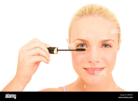 Woman applying mascara Stock Photo - Alamy
