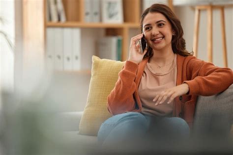 Premium Photo | Home phone call and woman on a couch smile and ...