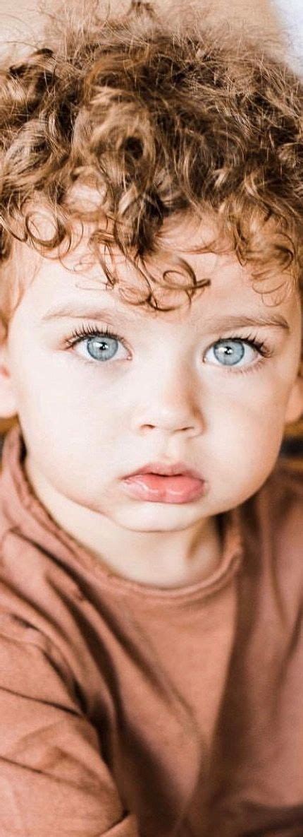 cute baby boys  green eyes  curly hair