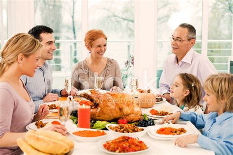 Extended Family Having Thanksgiving Dinner. Stock Photo | Royalty-Free ...