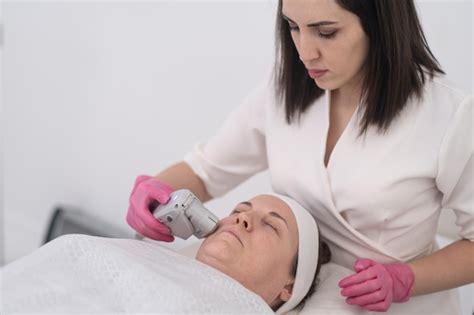premium photo middle aged woman experiencing laser face lift