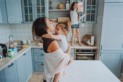 Happy family having fun in the kitchen 11342154 Stock Photo at Vecteezy