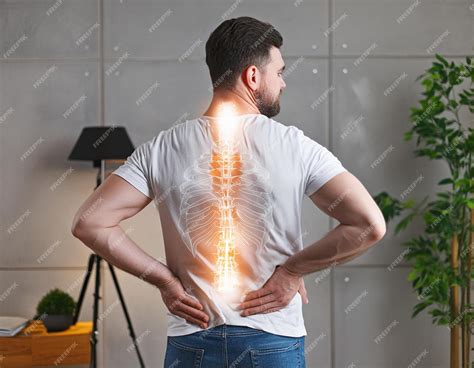 Premium Photo | Spinal health visualization Man experiencing back pain